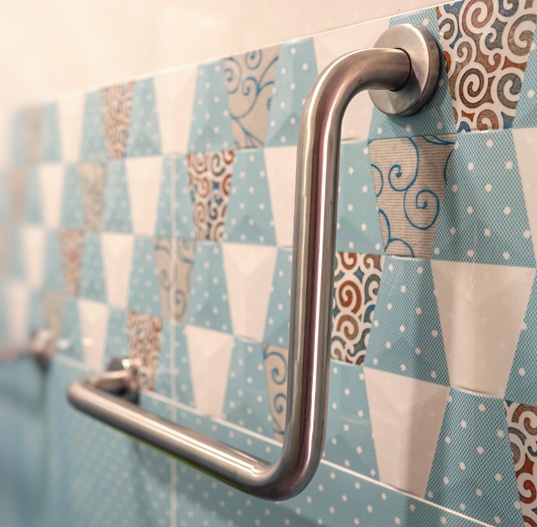 can you attach shower handles to tiled walls