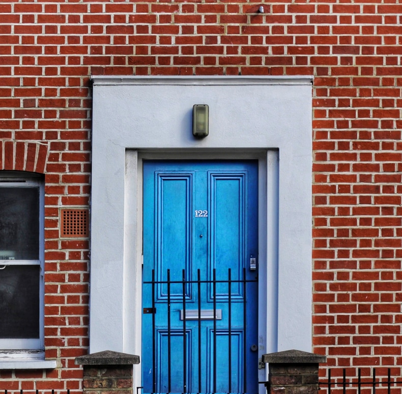red brick front door blue color