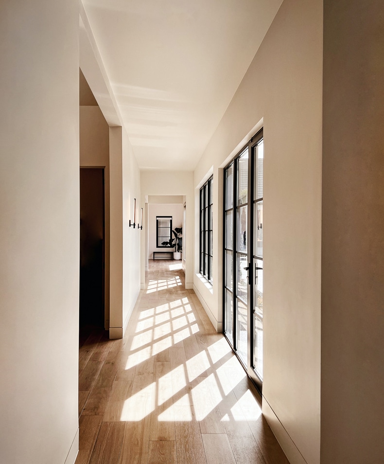 visually widen a narrow hallway by dividing the walls