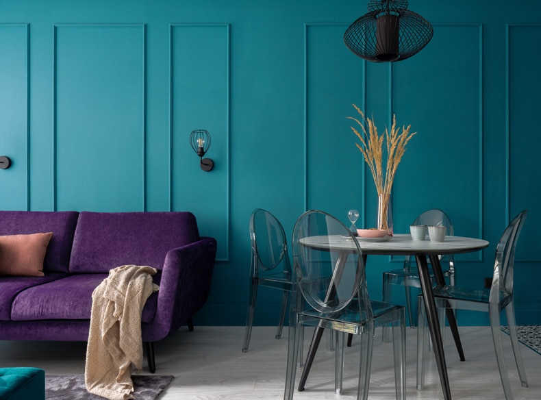 blue gray wall purple sofa