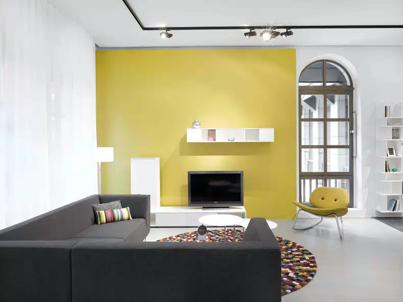 white and grey living room + yellow wall
