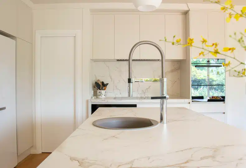 minimalist kitchen with a white granite countertop