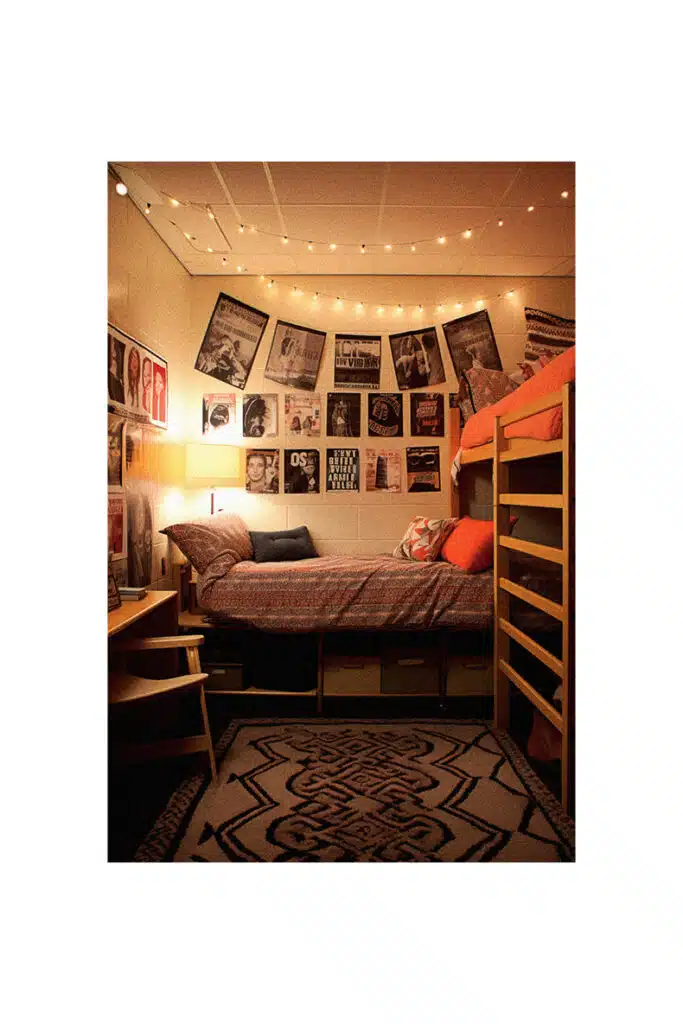 A cozy college dorm with a bunk bed and a desk.