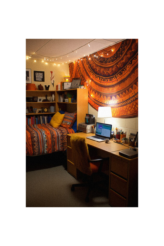 A dorm room with bed and desk ideas.