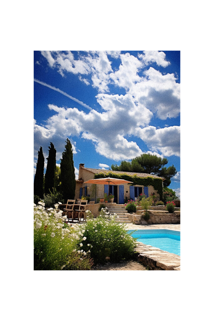 French Country Cottage with a swimming pool and a blue sky.