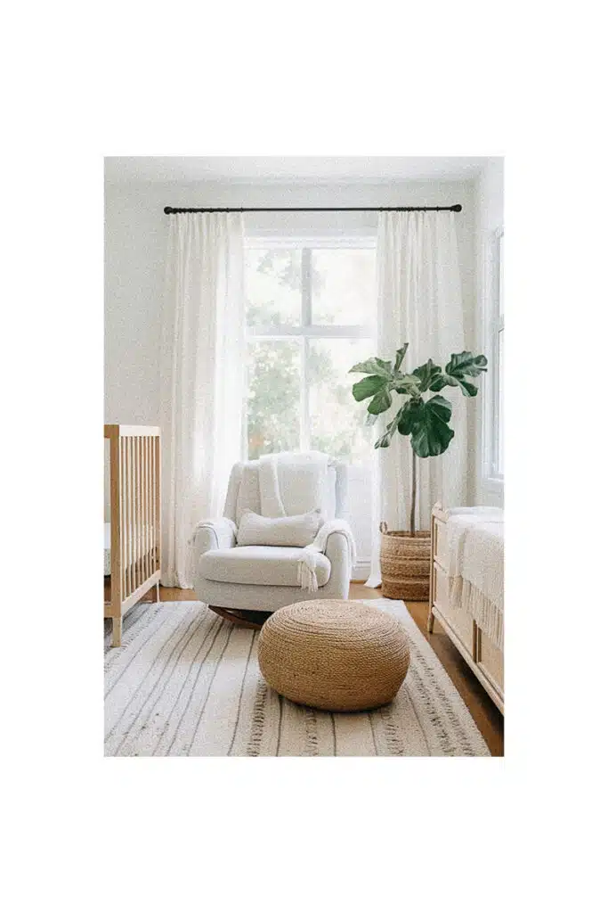 A nursery room with white furniture and a plant for inspiration.
