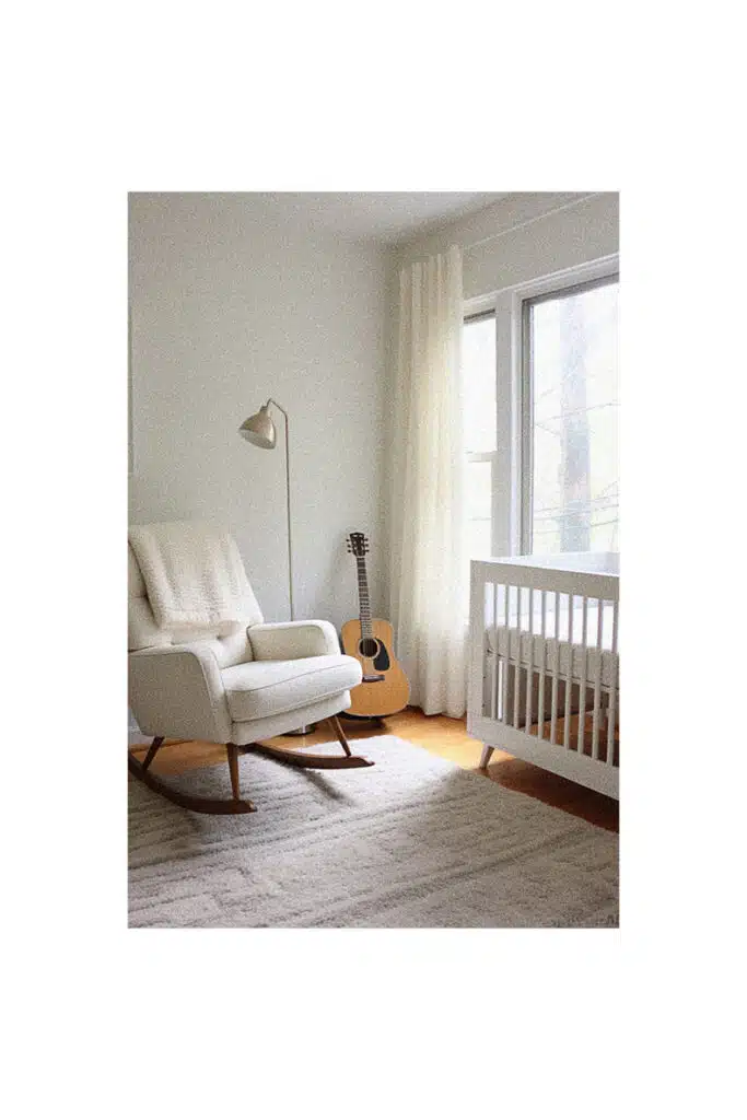 A white rocking chair in a nursery room.