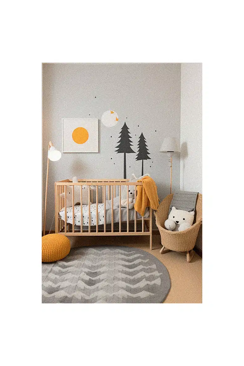 Nursery room with a crib and a chair providing inspiration.
