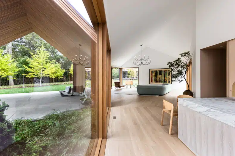 An open plan kitchen and dining area in a modern house.