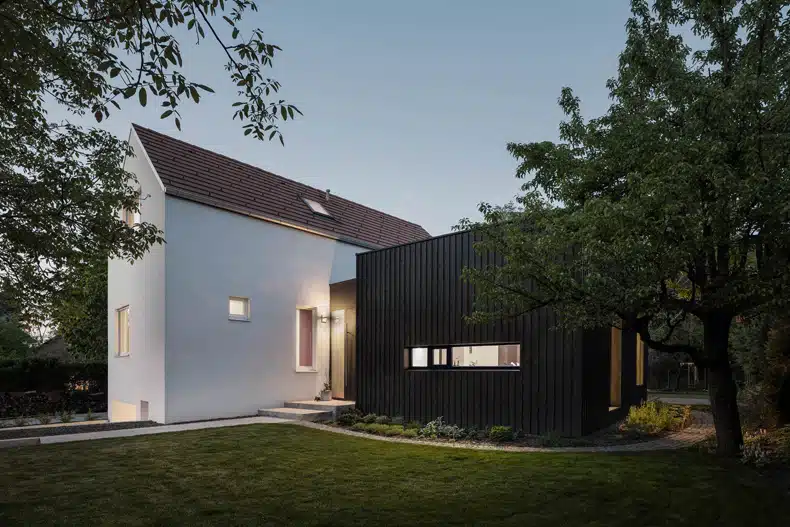 A modern house with a black exterior.