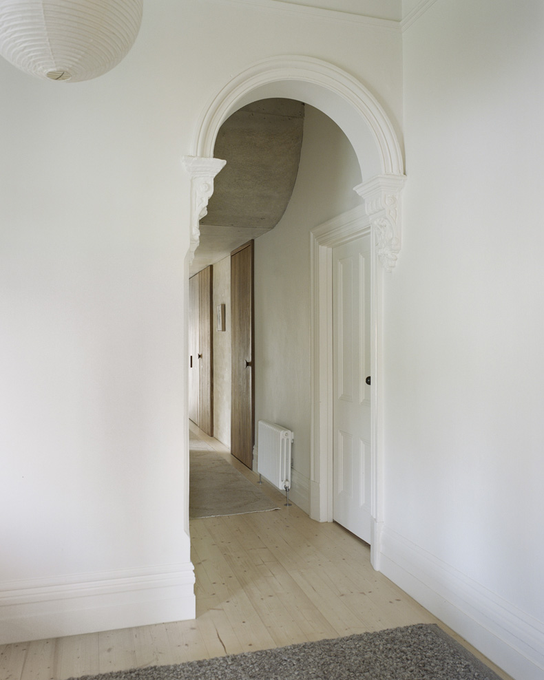 An archway in the Mary Street House hallway.