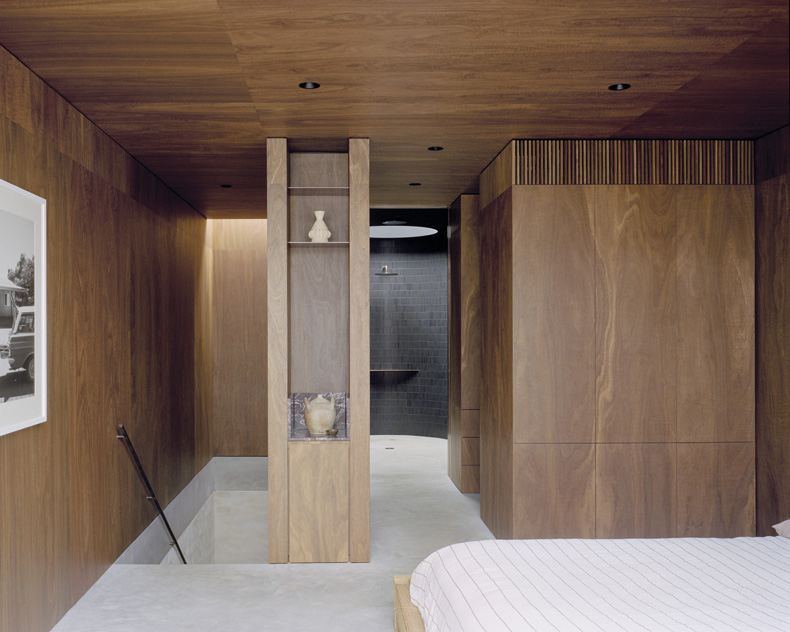 Mary Street House By Edition Office: A bedroom with wooden walls and a white bed.