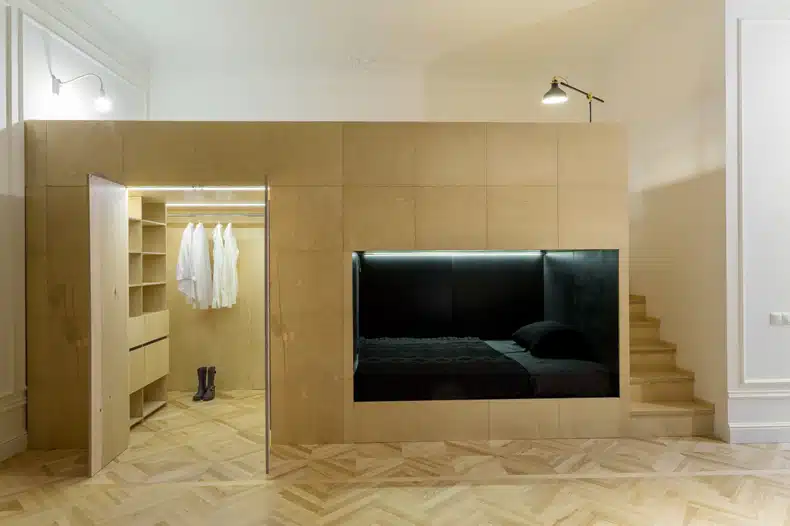A smart apartment with a bed and a closet.