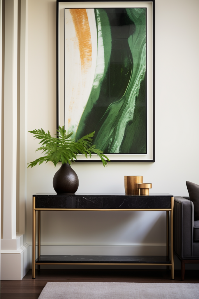 A living room with a gold console optimized for traffic flow and adorned with a green painting.