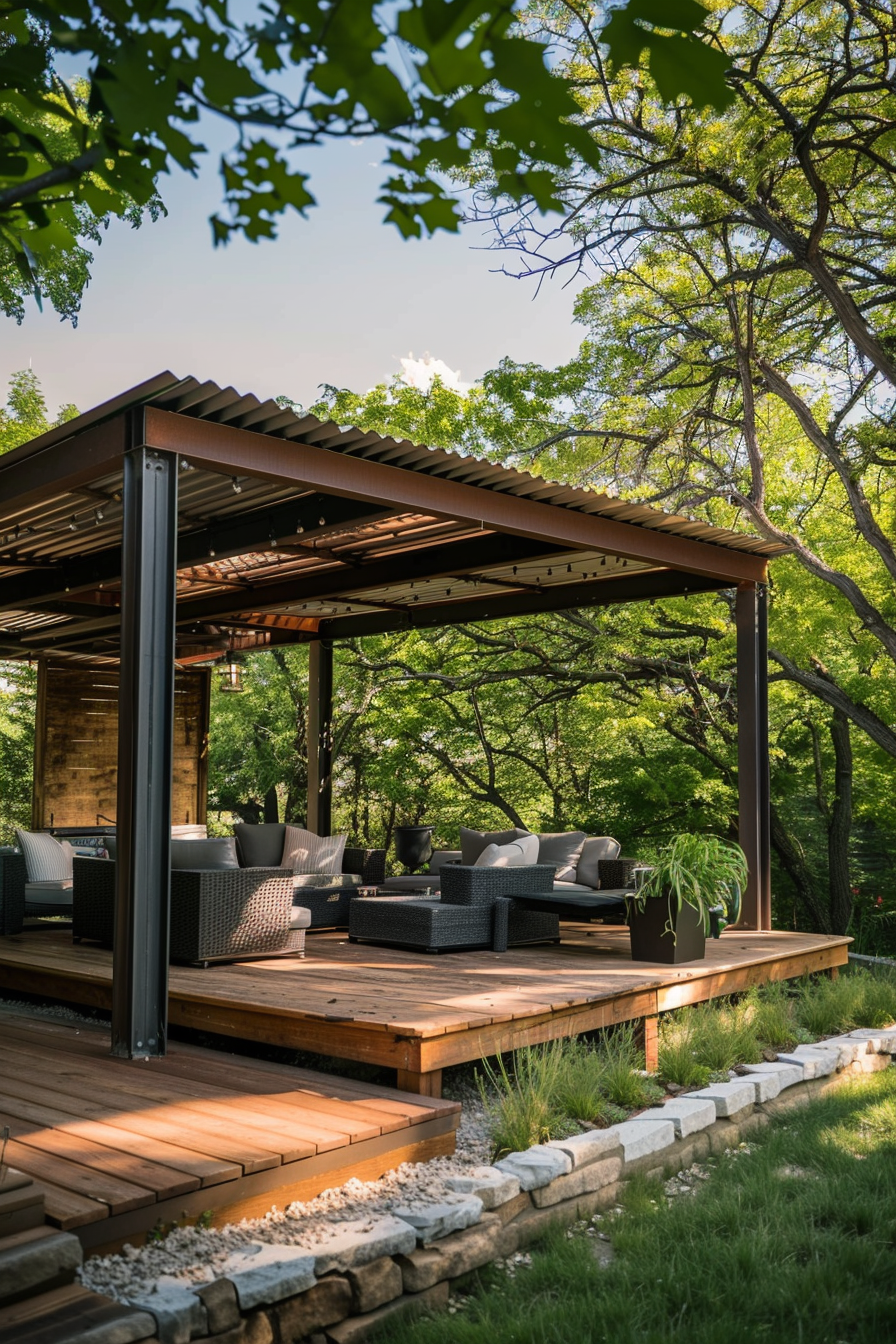 Outdoor patio area with modern wicker furniture under a metal pergola, surrounded by lush greenery and trees.