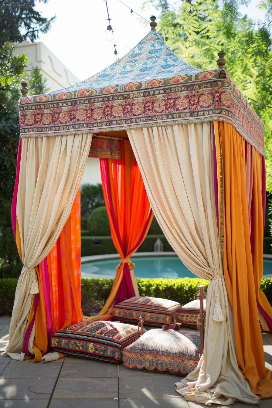A luxurious outdoor canopy with colorful drapes and patterned cushions by a swimming pool, evoking a relaxing, exotic atmosphere.