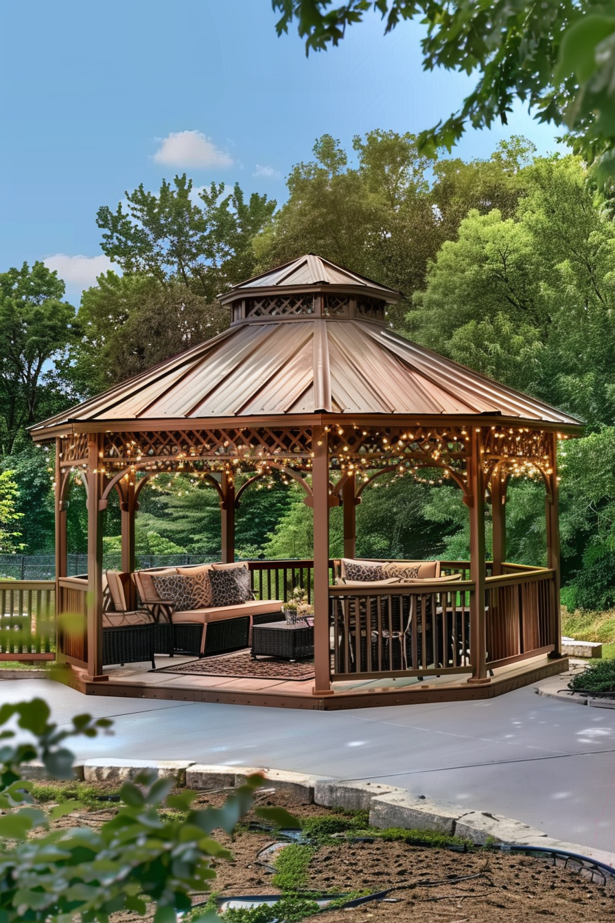 ALT: An elegant wooden gazebo with string lights and cozy furniture, surrounded by lush greenery in a serene backyard setting.