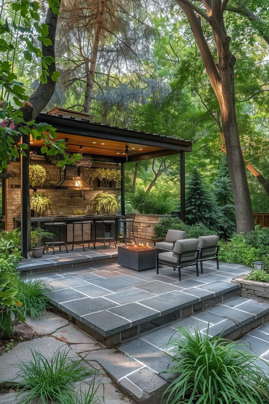 A cozy outdoor patio with a fire pit, seating area, and a covered dining space surrounded by greenery and trees.