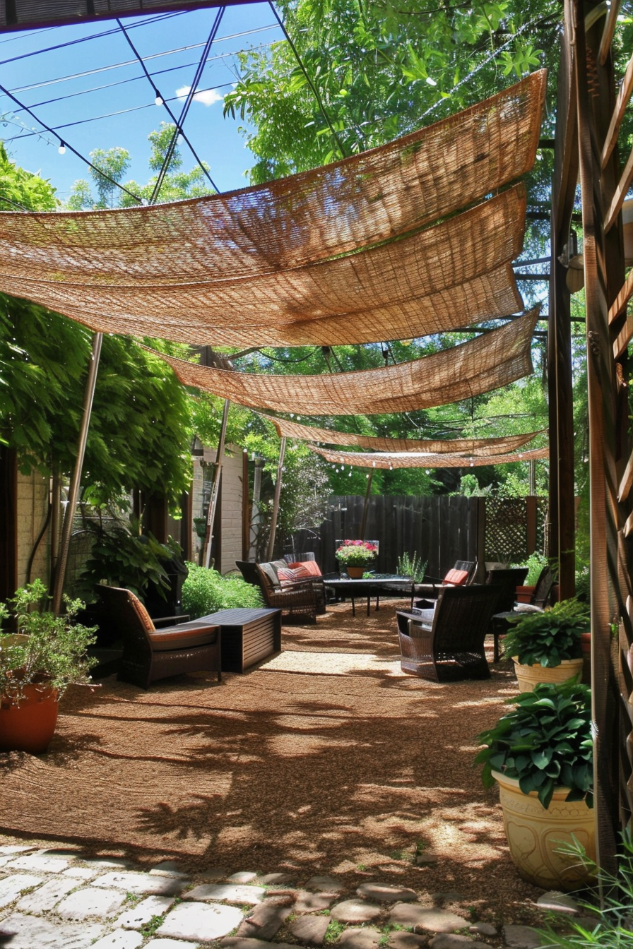 ALT: A cozy garden patio with wicker furniture and overhead shade cloths, surrounded by green plants and a pathway leading through.
