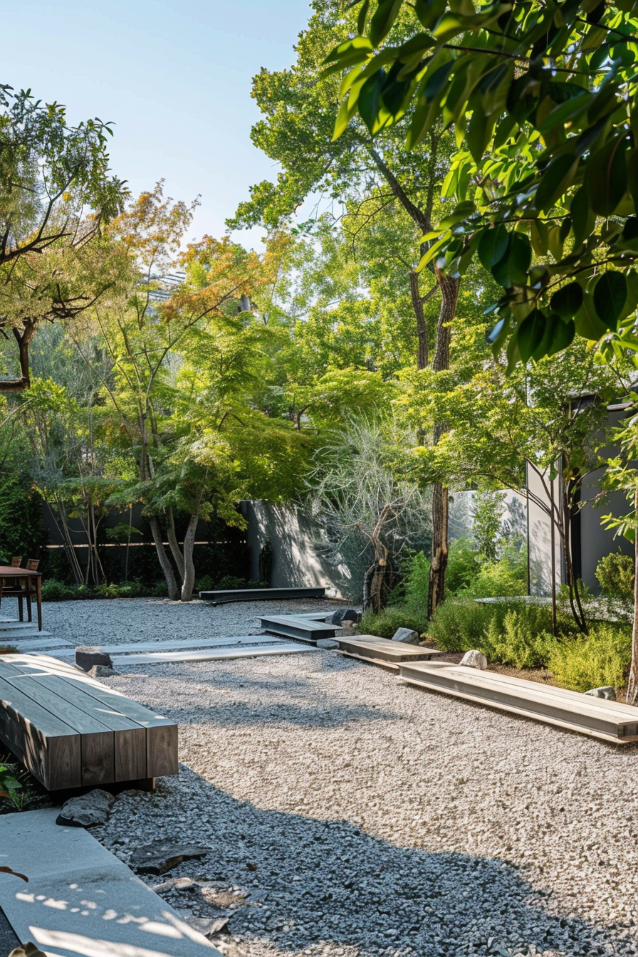 ALT: Tranquil garden with gravel paths, wooden benches, lush green trees, and modern sculptures in a serene outdoor setting.