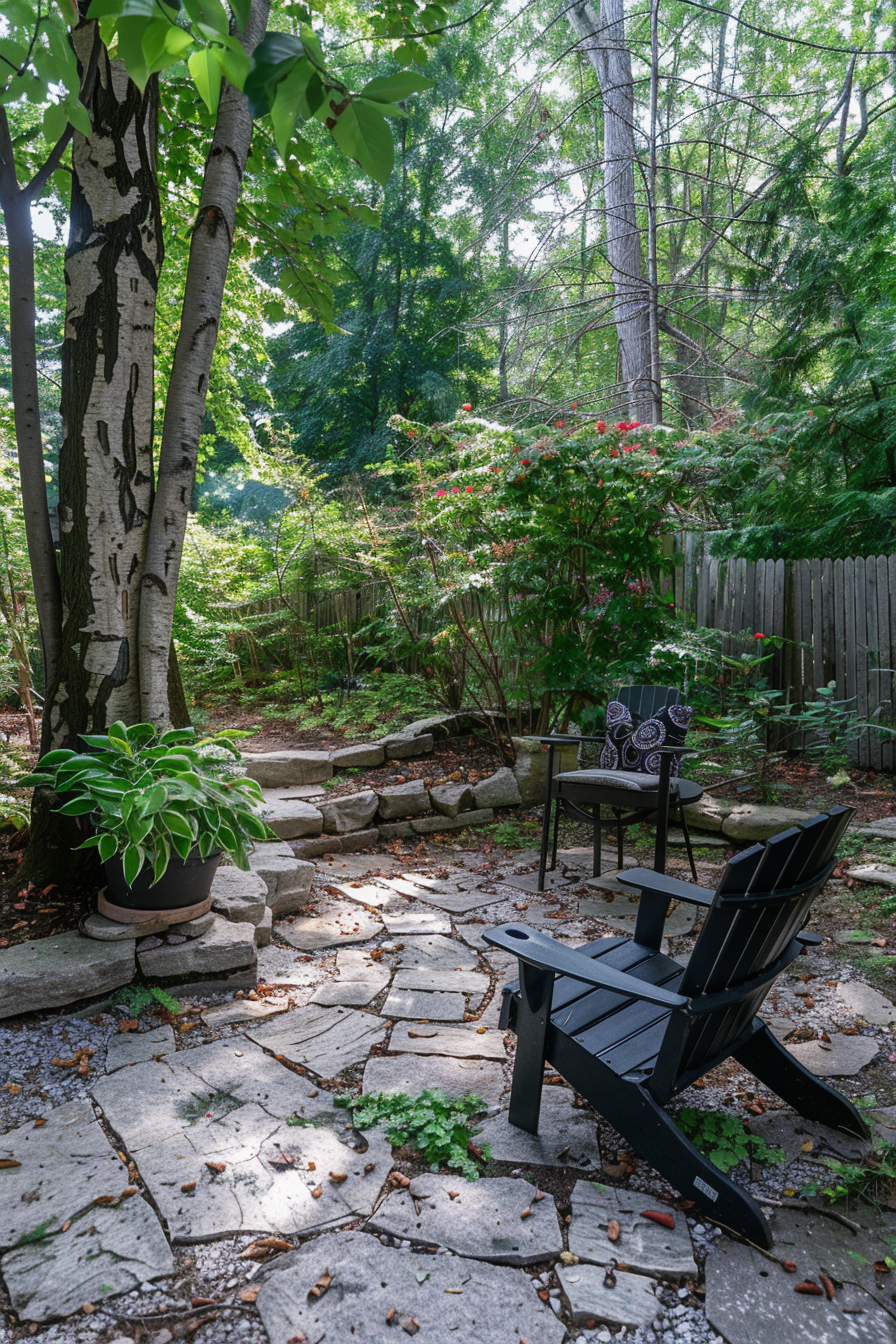Tranquil garden corner with Adirondack chair, stone pathway, blooming plants, and a backdrop of dense trees.