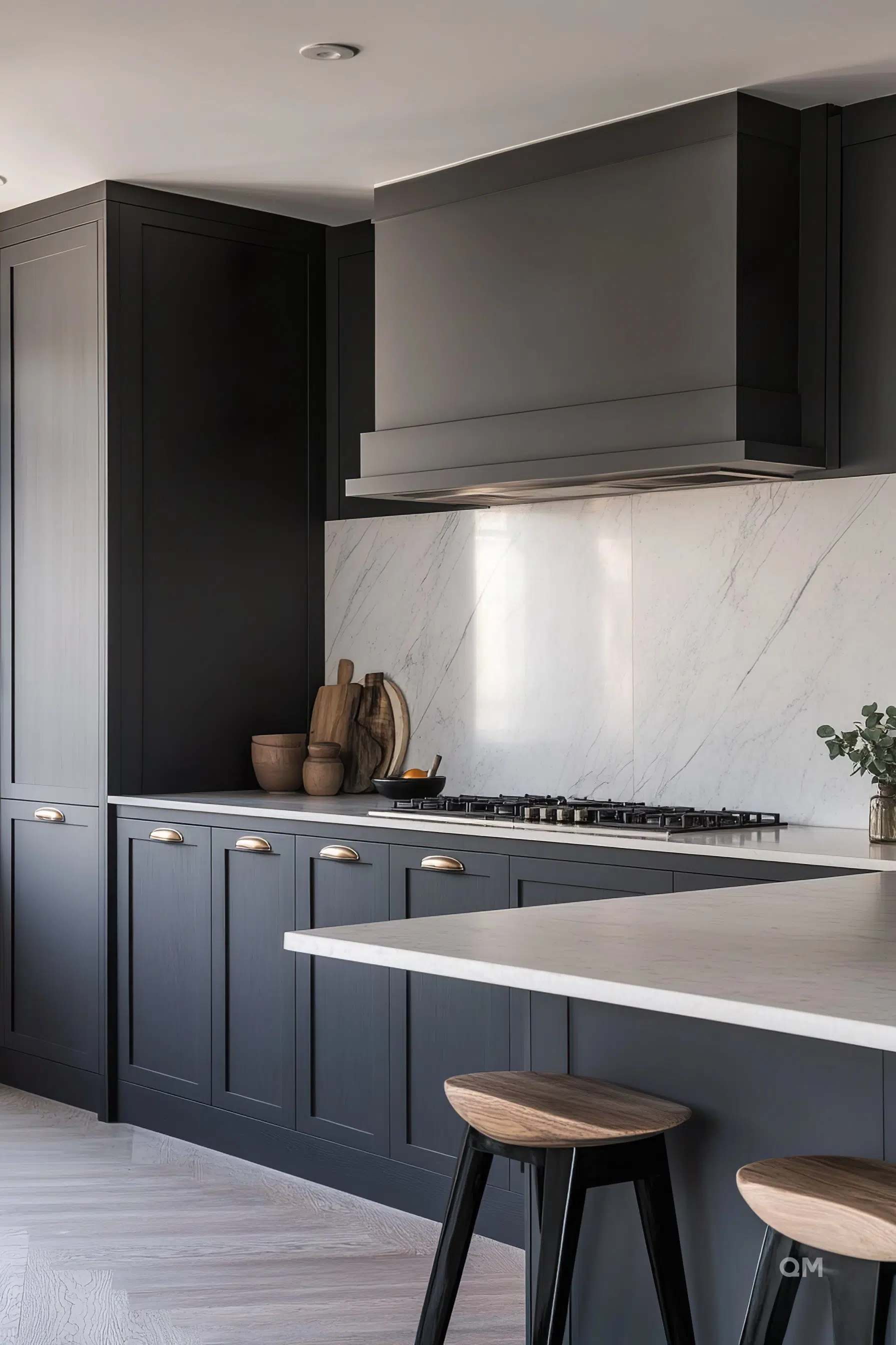 Modern kitchen with dark cabinets, marble backsplash, gas stove, and wooden accents with bar stools. Modern kitchen with dark cabinets, marble backsplash, gas stove, and wooden accents with bar stools.