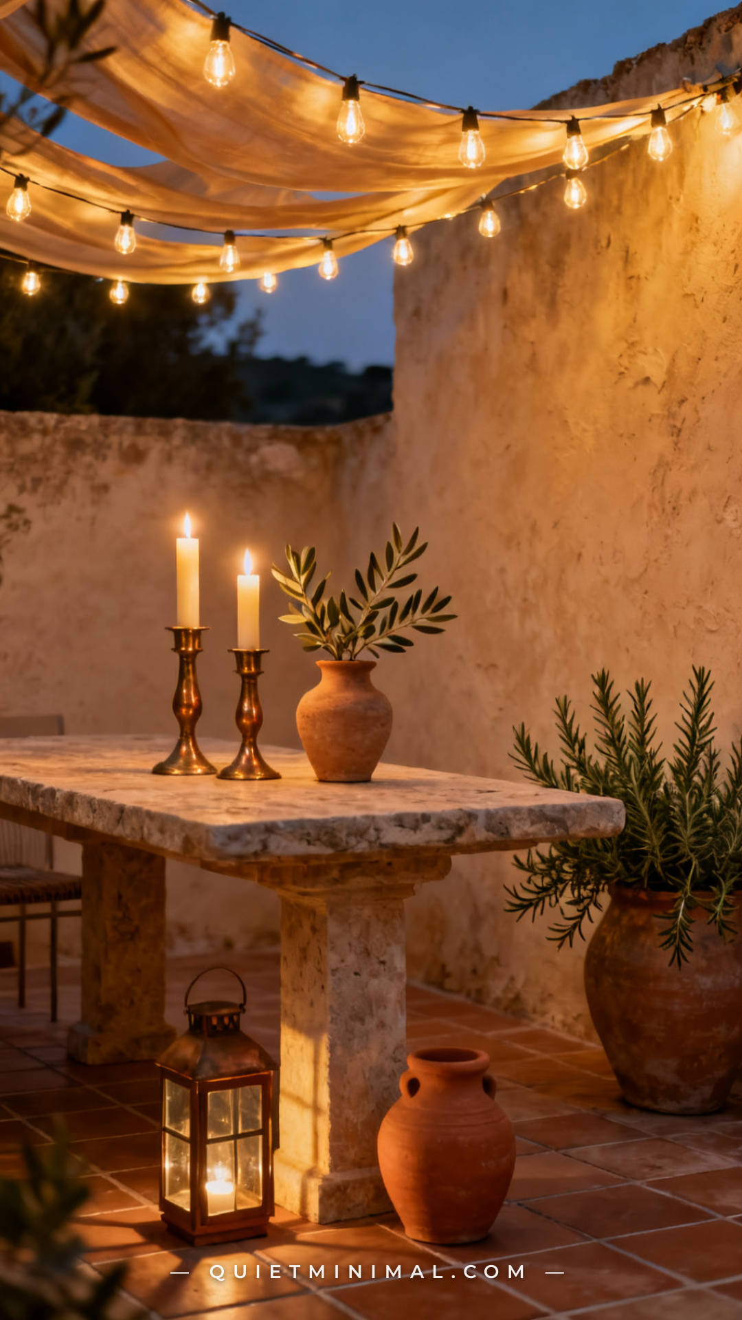 A medium-wide photograph of a stone patio table at dusk