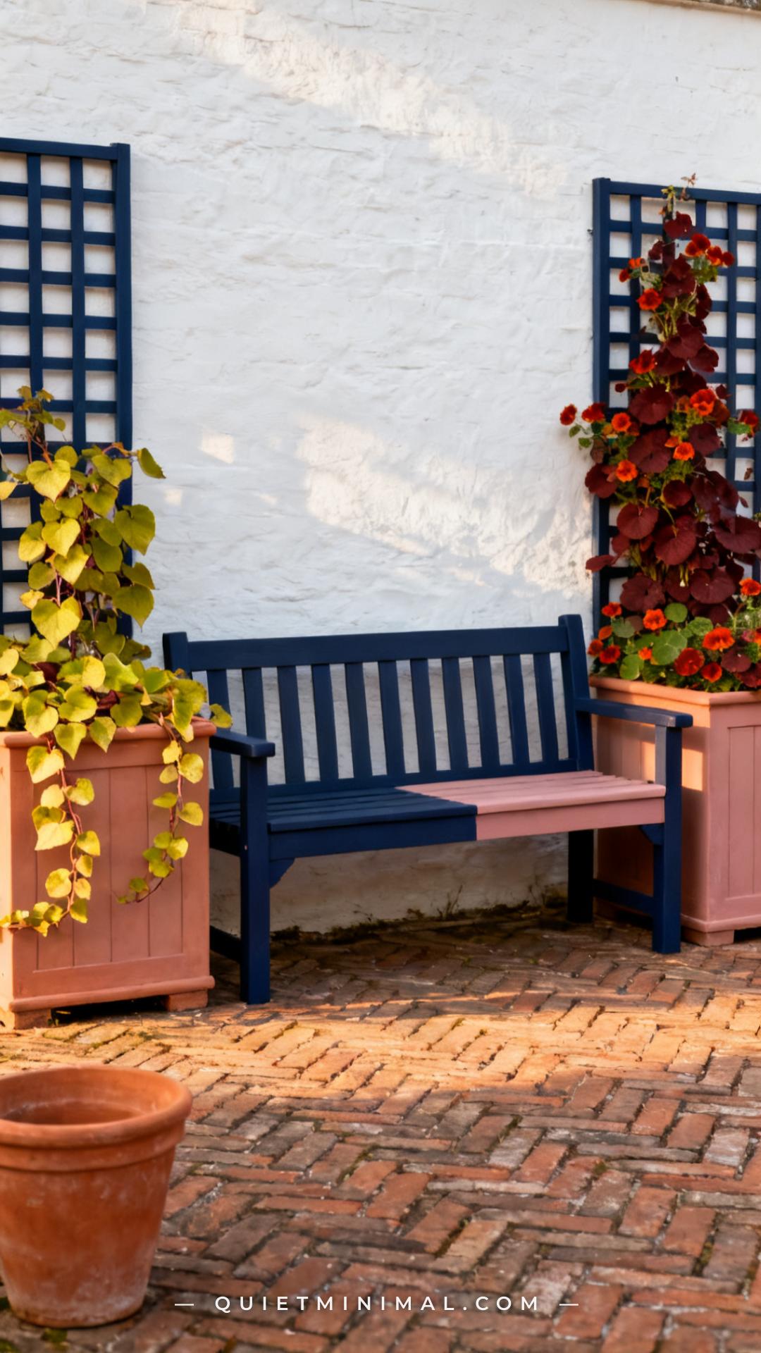 A vertical establishing photograph of a garden bench where the bench frame and seat are painted in a deep navy blue and