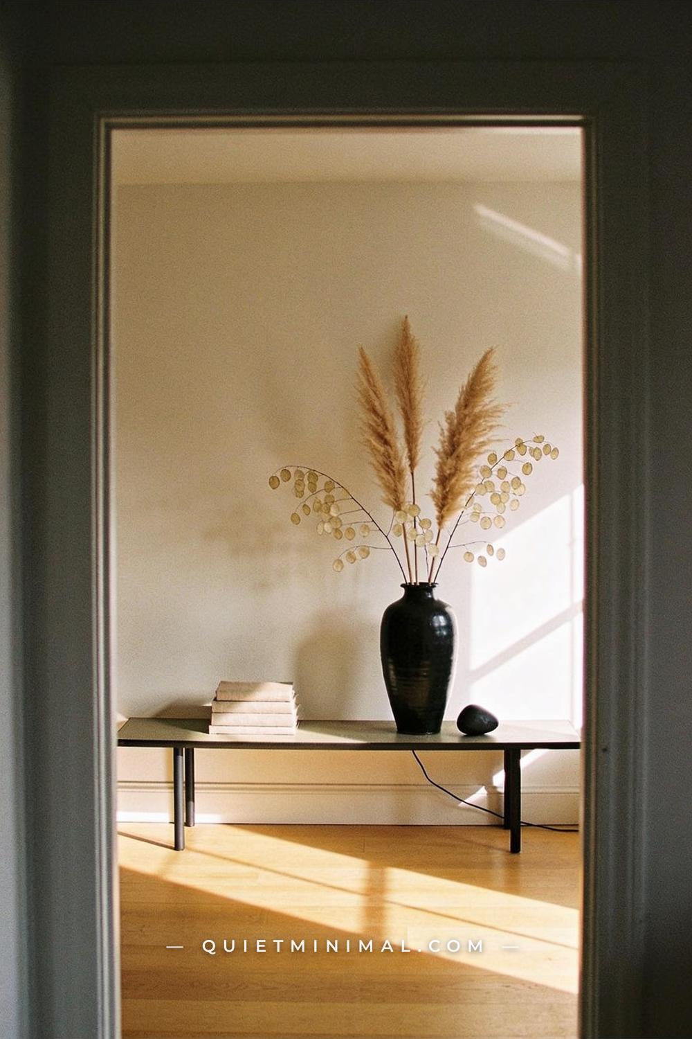 A wide establishing shot taken from the doorway of a quiet living room