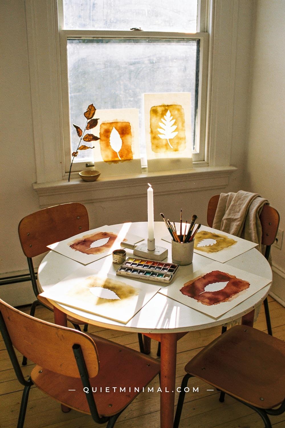 A wide establishing shot from across the room of a small round kids table