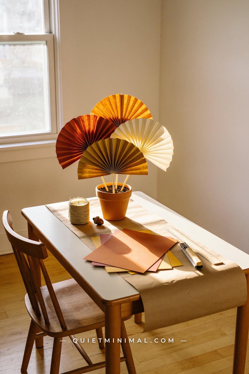 A wide establishing shot from across the room of a small rectangular kids table