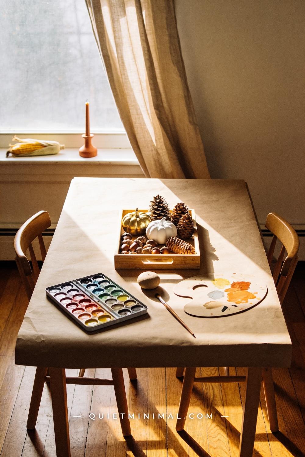 A wide establishing shot from a straight-on vantage across a low rectangular kids table