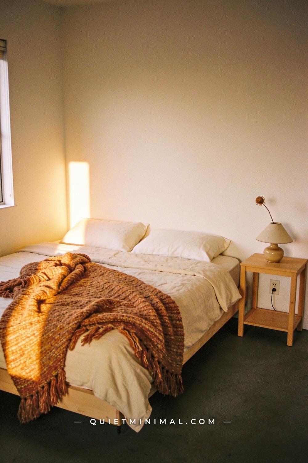 A wide establishing shot taken from across a bedroom